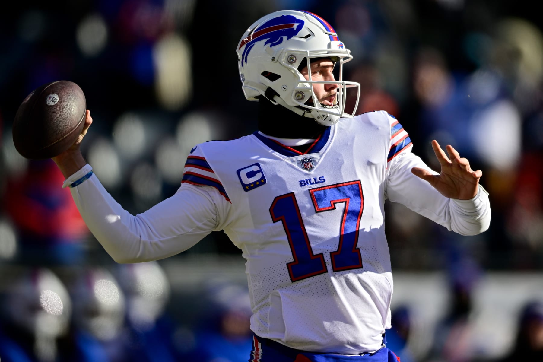 CHICAGO, ILLINOIS - DECEMBER 24: Josh Allen #17 of the Buffalo Bills throws a pass during the first quarter in the game against the Chicago Bills at Soldier Field on December 24, 2022 in Chicago, Illinois. (Photo by Quinn Harris/Getty Images)