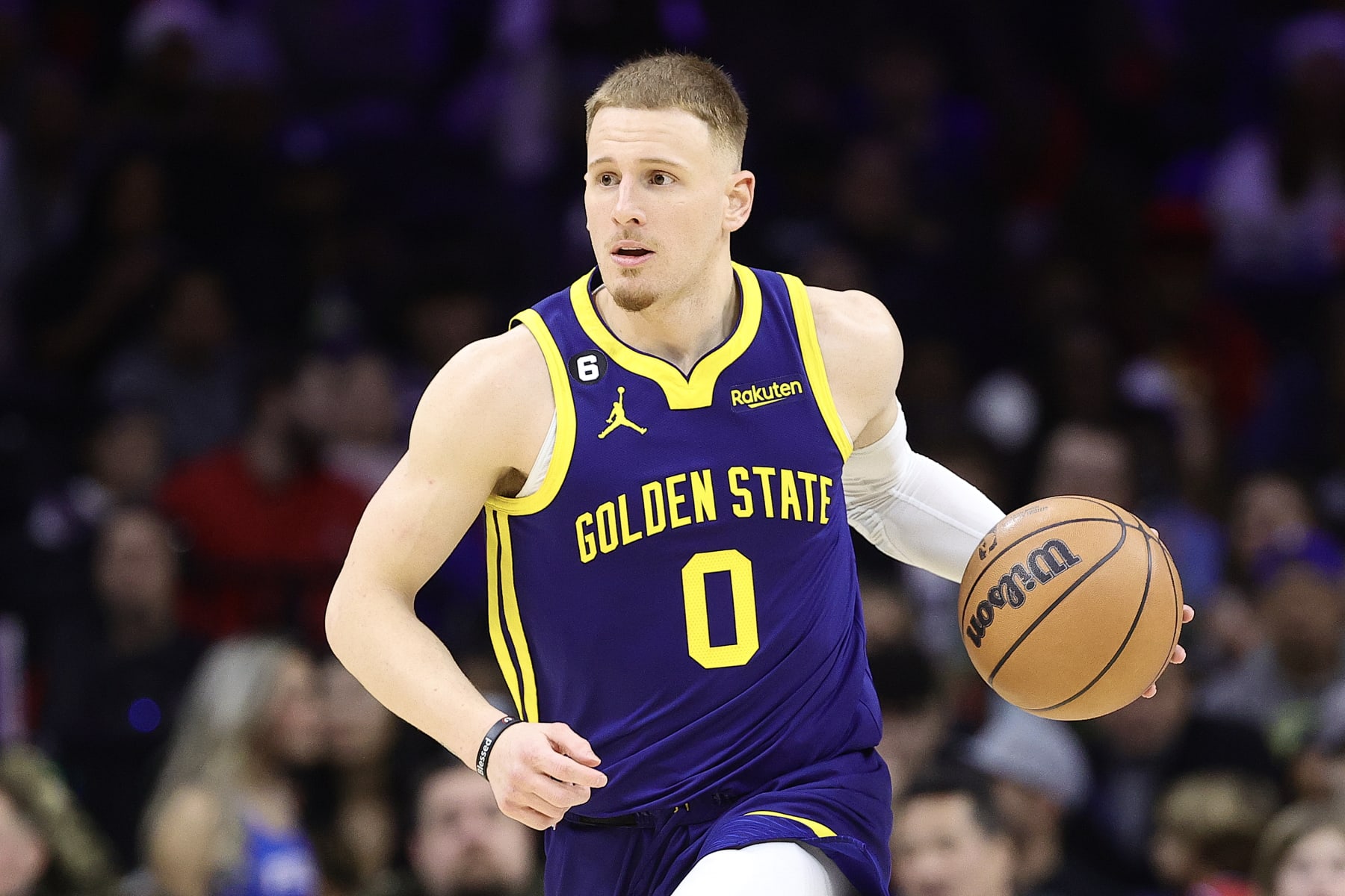 PHILADELPHIA, PENNSYLVANIA - DECEMBER 16: Donte DiVincenzo #0 of the Golden State Warriors dribbkes during the third quarter against the Philadelphia 76ers at Wells Fargo Center on December 16, 2022 in Philadelphia, Pennsylvania. NOTE TO USER: User expressly acknowledges and agrees that, by downloading and or using this photograph, User is consenting to the terms and conditions of the Getty Images License Agreement. (Photo by Tim Nwachukwu/Getty Images)