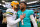 MIAMI GARDENS, FLORIDA - DECEMBER 25: Aaron Rodgers #12 of the Green Bay Packers hugs Tua Tagovailoa #1 of the Miami Dolphins on the field after the game at Hard Rock Stadium on December 25, 2022 in Miami Gardens, Florida. (Photo by Megan Briggs/Getty Images)