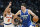 Dallas Mavericks guard Luka Doncic (77) drives against New York Knicks guard Quentin Grimes (6) during the first quarter of an NBA basketball game in Dallas, Tuesday, Dec. 27, 2022. (AP Photo/LM Otero)