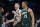 Boston, MA - December 25: Boston Celtics PF Grant Williams, right, and SF Sam Hauser smile as they return to the bench. The Celtics beat the Milwaukee Bucks, 139-118. (Photo by Erin Clark/The Boston Globe via Getty Images)