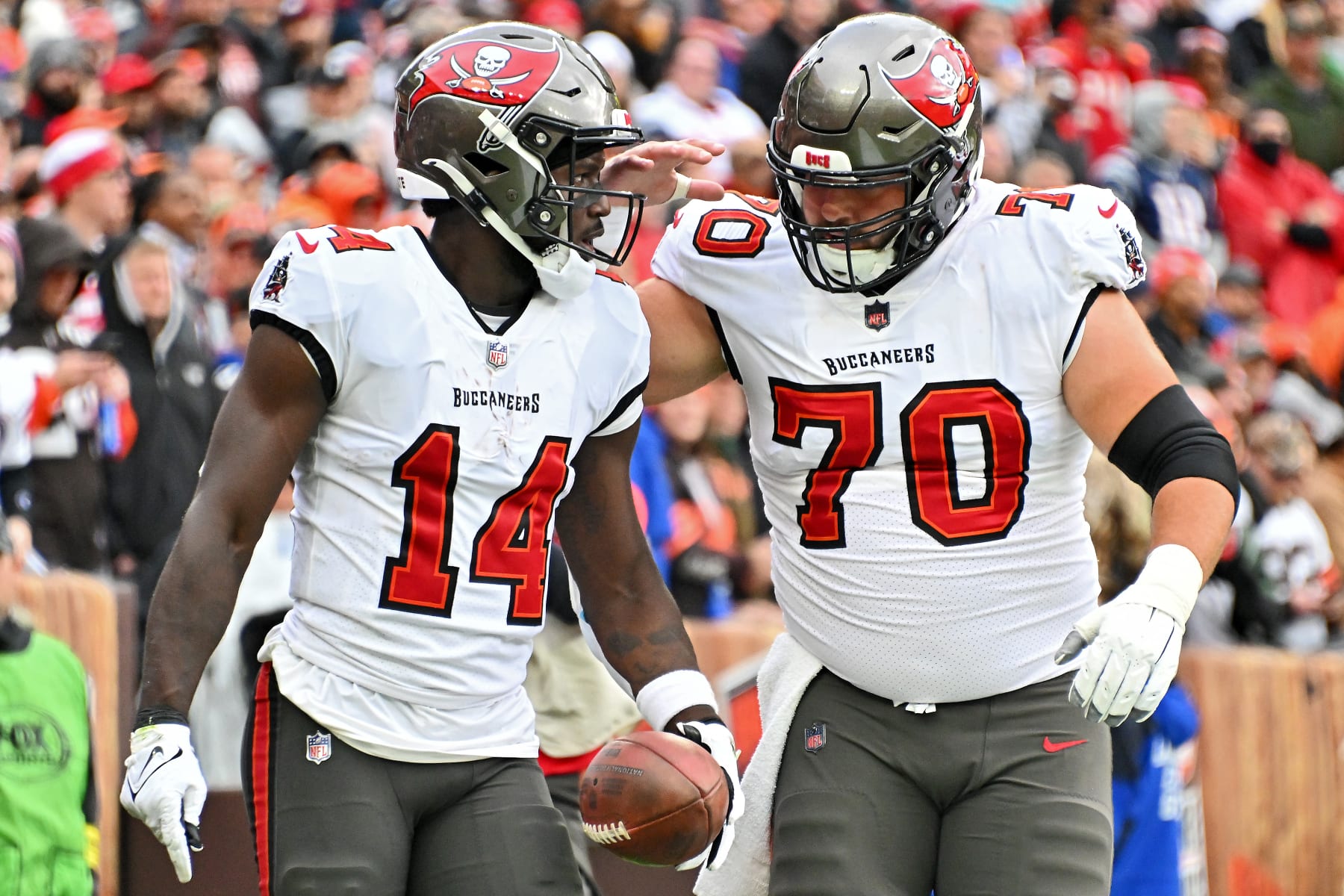 CLEVELAND, OHIO - NOVEMBER 27: Chris Godwin #14 of the Tampa Bay Buccaneers celebrates a touchdown with Robert Hainsey #70 during the first half against the Cleveland Browns at FirstEnergy Stadium on November 27, 2022 in Cleveland, Ohio. (Photo by Jason Miller/Getty Images)
