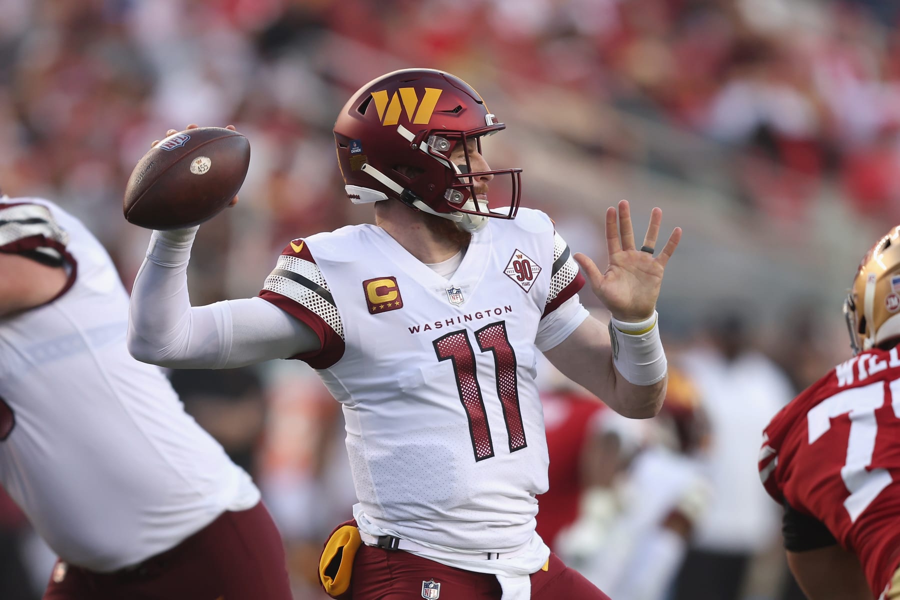 SANTA CLARA, CALIFORNIA - DECEMBER 24: Carson Wentz #11 of the Washington Commanders passes the ball in the fourth quarter against the San Francisco 49ers at Levi's Stadium on December 24, 2022 in Santa Clara, California. (Photo by Lachlan Cunningham/Getty Images)