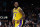 ATLANTA, GEORGIA - DECEMBER 30:  LeBron James #6 of the Los Angeles Lakers reacts after shooting a three-point basket against Onyeka Okongwu #17 of the Atlanta Hawks during the fourth quarter at State Farm Arena on December 30, 2022 in Atlanta, Georgia.  NOTE TO USER: User expressly acknowledges and agrees that, by downloading and or using this photograph, User is consenting to the terms and conditions of the Getty Images License Agreement.  (Photo by Kevin C. Cox/Getty Images)