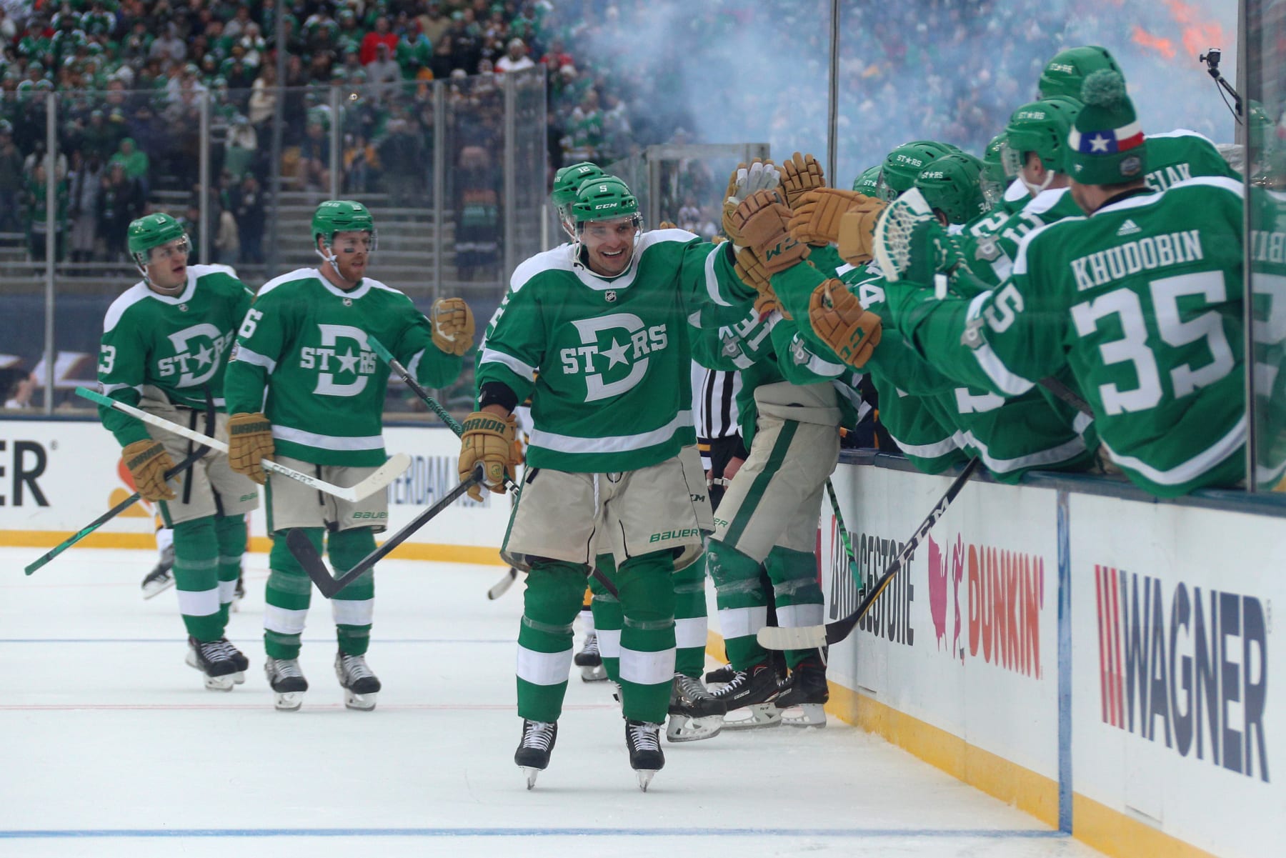 DALLAS, TEXAS - JANUARY 01: Andrej Sekera #5 of the Dallas Stars celebrate his goal with teammates on the bench during the third period of the 2020 NHL Winter Classic between the Nashville Predators and the Dallas Stars at Cotton Bowl on January 01, 2020 in Dallas, Texas. The Stars defeated the Predators 4-2. (Photo by Dave Sandford/NHLI via Getty Images)