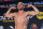 FORT LAUDERDALE, FL - SEPTEMBER 10: Tito Ortiz  flexes during the weigh-in ahead of his fight against Anderson Silva on September 11 at The Harbor Beach Marriott on September 10, 2021 in Fort Lauderdale, Florida. (Photo by Eric Espada/Getty Images)