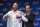 With the help of New York Mets general manager Billy Eppler, right, pitcher Justin Verlander puts on his new jersey during a news conference at Citi Field, Tuesday, Dec. 20, 2022, in New York. The team introduced Verlander after they agreed to a $86.7 million, two-year contract. It's part of an offseason spending spree in which the Mets have committed $476.7 million on seven free agents. (AP Photo/Seth Wenig)