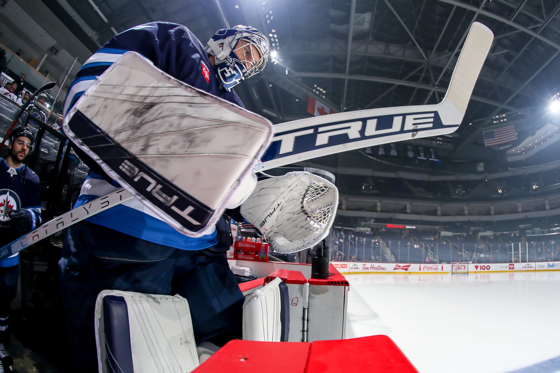 WINNIPEG, CANADA - DECEMBER 13: Goaltender Connor Hellebuyck #37 of the Winnipeg Jets hits the ice for the pre-game warm up prior to NHL action against the Vegas Golden Knights at the Canada Life Centre on December 13, 2022 in Winnipeg, Manitoba, Canada. (Photo by Darcy Finley/NHLI via Getty Images)
