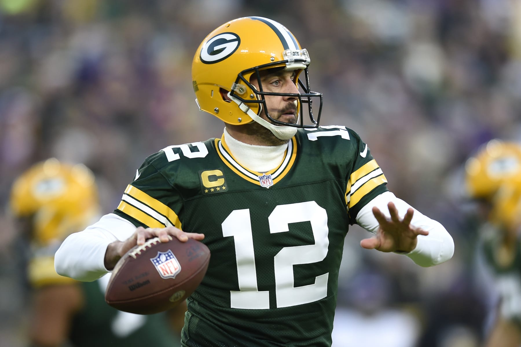 GREEN BAY, WISCONSIN - JANUARY 01: Aaron Rodgers #12 of the Green Bay Packers throws a pass during the first quarter against the Minnesota Vikings at Lambeau Field on January 01, 2023 in Green Bay, Wisconsin. (Photo by Kayla Wolf/Getty Images)