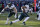 Philadelphia Eagles' Jalen Hurts carries the ball as tight end Jack Stoll protects his backside during an NFL football game against the Chicago Bears Sunday, Dec. 18, 2022, in Chicago. (AP Photo/Charles Rex Arbogast)