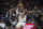Sacramento Kings guard De'Aaron Fox (5) and forward Harrison Barnes (40) defend against Los Angeles Lakers forward LeBron James (6) during the second half of an NBA basketball game in Sacramento, Calif., Saturday, Jan. 7, 2023. The Lakers won 136-134. (AP Photo/José Luis Villegas)