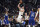 Dallas Mavericks guard Luka Doncic, center, shoots as Los Angeles Clippers forward Norman Powell, left, and guard Terance Mann defend during the second half of an NBA basketball game Tuesday, Jan. 10, 2023, in Los Angeles. (AP Photo/Mark J. Terrill)