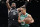 Boston Celtics guard Malcolm Brogdon (13) drives against Brooklyn Nets guard Kyrie Irving (11) during the first half of an NBA basketball game Thursday, Jan. 12, 2023, in New York. (AP Photo/Mary Altaffer)