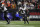 アメリカ Baltimore Ravens running back J.K. Dobbins runs with the ball in the first half of an NFL wild-card playoff football game against the Cincinnati Bengals in Cincinnati, Sunday, Jan. 15, 2023. (AP Photo/Jeff Dean)