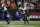 Baltimore Ravens running back J.K. Dobbins runs with the ball in the first half of an NFL wild-card playoff football game against the Cincinnati Bengals in Cincinnati, Sunday, Jan. 15, 2023. (AP Photo/Jeff Dean)