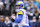 SEATTLE, WASHINGTON - JANUARY 08: Baker Mayfield #17 of the Los Angeles Rams looks to throw the ball during the first quarter against the Seattle Seahawks at Lumen Field on January 08, 2023 in Seattle, Washington. (Photo by Steph Chambers/Getty Images)