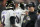 Baltimore Ravens head coach John Harbaugh, right, talks with quarterback Tyler Huntley (2) in the first half of an NFL wild-card playoff football game against the Cincinnati Bengals in Cincinnati, Sunday, Jan. 15, 2023. (AP Photo/Darron Cummings)