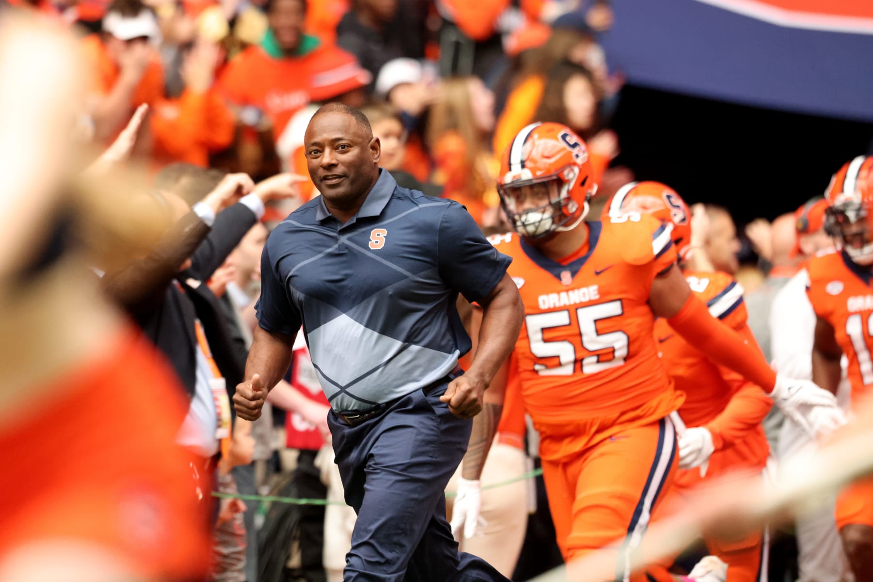 SYRACUSE, NEW YORK - OCTOBER 29: Head Coach Dino Babers of the Syracuse Orange leads his team to the field prior to a game against the Notre Dame Fighting Irish at JMA Wireless Dome on October 29, 2022 in Syracuse, New York. (Photo by Bryan M. Bennett/Getty Images)