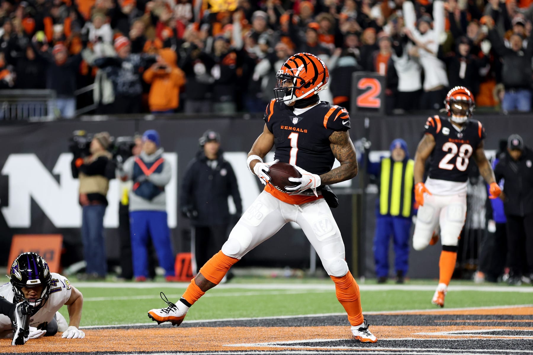 CINCINNATI, OHIO - JANUARY 15: Ja'Marr Chase #1 of the Cincinnati Bengals celebrates after scoring a 7 yard touchdown against the Baltimore Ravens during the second quarter in the AFC Wild Card playoff game at Paycor Stadium on January 15, 2023 in Cincinnati, Ohio. (Photo by Rob Carr/Getty Images)