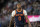 New York Knicks forward Cam Reddish (0) in the second half of an NBA basketball game Wednesday, Nov. 16, 2022, in Denver. (AP Photo/David Zalubowski)