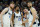 Dallas Mavericks forward Davis Bertans, left, Mavericks guards Spencer Dinwiddie (26), Luka Doncic, second from right, and Mavericks forward Maxi Kleber (42) huddle up during the second half of Game 5 of an NBA basketball second-round playoff series against the Phoenix Suns Tuesday, May 10, 2022, in Phoenix. The Suns won 110-80. (AP Photo/Ross D. Franklin)