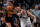 DALLAS, TEXAS - JANUARY 18: John Collins #20 of the Atlanta Hawks scrambles for the ball against Luka Doncic #77 of the Dallas Mavericks in the second quarter at American Airlines Center on January 18, 2023 in Dallas, Texas. NOTE TO USER: User expressly acknowledges and agrees that, by downloading and or using this photograph, User is consenting to the terms and conditions of the Getty Images License Agreement. (Photo by Tom Pennington/Getty Images)