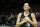 Seattle Storm guard Sue Bird puts her hands over her heart as she acknowledges fans chanting her name after her team was eliminated from the playoffs by the Las Vegas Aces in Game 4 of a WNBA basketball playoff semifinal, making it her last career game, Tuesday, Sept. 6, 2022, in Seattle. The Aces beat the Storm 97-92 to advance to the WNBA Finals. (AP Photo/Lindsey Wasson)