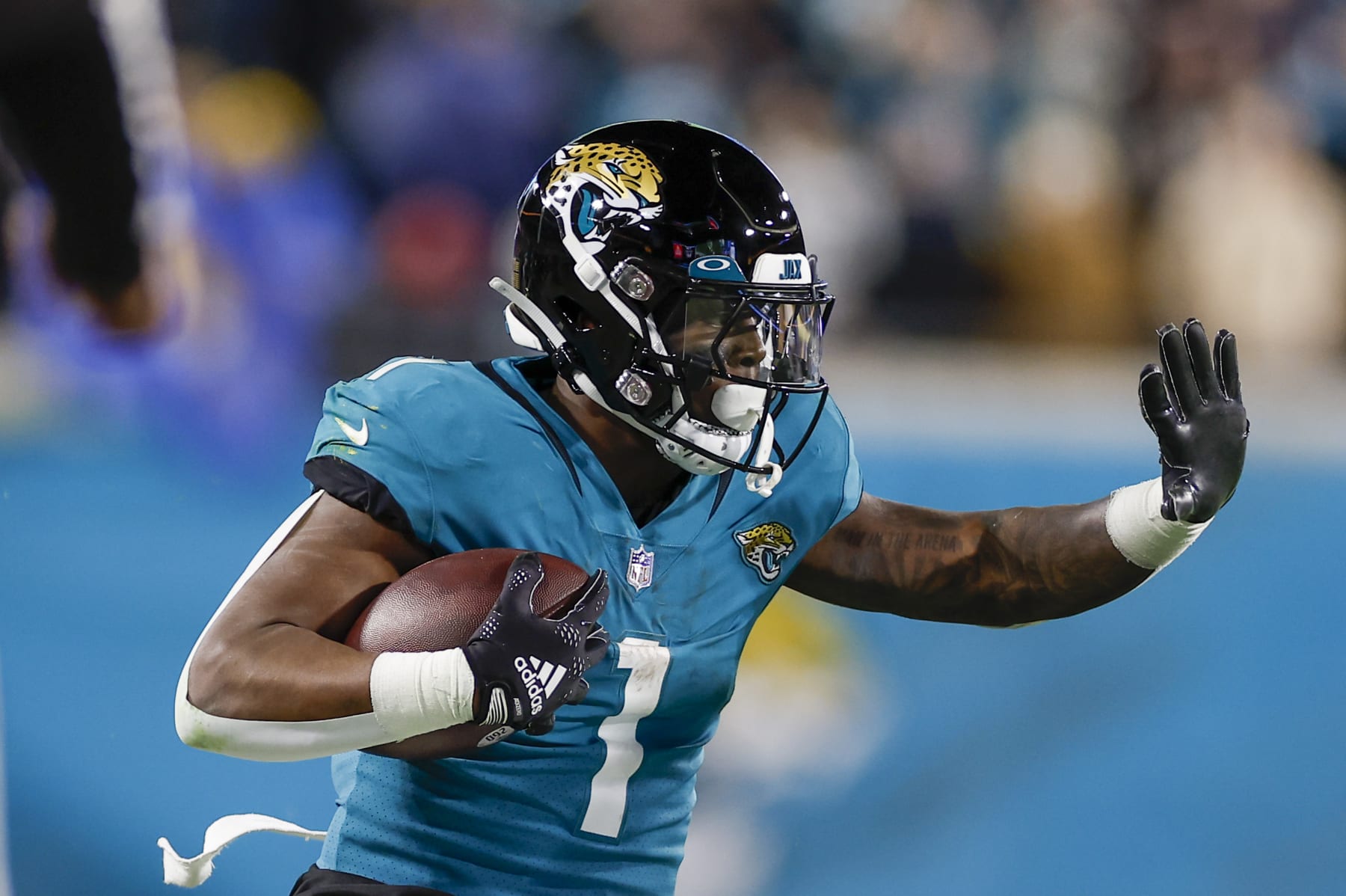 JACKSONVILLE, FL - JANUARY 14:Jacksonville Jaguars running back Travis Etienne Jr. (1) runs with the ball during the game between the Los Angeles Chargers and the Jacksonville Jaguars on January 14, 2023 at TIAA Bank Field in Jacksonville, Fl. (Photo by David Rosenblum/Icon Sportswire via Getty Images)