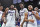 MANHATTAN, KS - JANUARY 17: Coach Jerome Tang of the Kansas State Wildcats (R) celebrates with players Marquis Noel #1, Naiquan Tomlin #35, Daisy Seals #13 and David Njesan #3 of Kansas State.  The Wildcats, after defeating the Kansas Jayhawks in overtime 83-82 at Bramlage Coliseum on January 17, 2023 in Manhattan, Kansas.  (Photo by Peter Aiken/Getty Images)