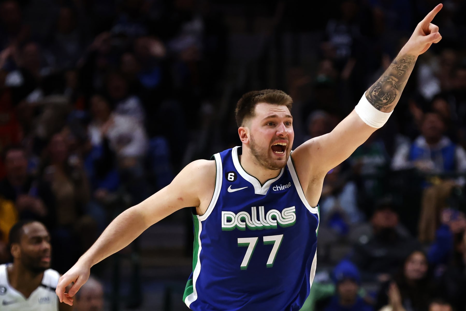 DALLAS, TX - JANUARY 30: Luka Doncic #77 of the Dallas Mavericks reacts after scoring a basket against the Detroit Pistons in the second half at American Airlines Center on January 30, 2023 in Dallas, Texas. The Mavericks won 111-105. NOTE TO USER: User expressly acknowledges and agrees that, by downloading and or using this photograph, User is consenting to the terms and conditions of the Getty Images License Agreement. (Photo by Ron Jenkins/Getty Images)