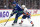 VANCOUVER, CANADA - JANUARY 3: Bo Horvat #53 of the Vancouver Canucks and Sebastian Aho #25 of the New York Islanders battle for the puck during the first period of their NHL game at Rogers Arena January 3, 2023 in Vancouver, British Columbia, Canada. (Photo by Jeff Vinnick/NHLI via Getty Images)