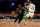 BOSTON, MA - FEBRUARY 1: Kyrie Irving #11 of the Brooklyn Nets passes Malcolm Brogdon #13 of the Boston Celtics in the first half at TD Garden on February 1, 2023 in Boston, Massachusetts dribble  (Photo by Maddie Meyer/Getty Images)