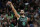 Boston Celtics' Derrick White watches his 3-pointer during the first half of an NBA basketball game against the Charlotte Hornets, Friday, Feb. 10, 2023, in Boston. (AP Photo/Michael Dwyer)