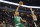 Boston Celtics guard Malcolm Brogdon (13) drives against Milwaukee Bucks Joe Ingles during an NBA basketball game, Tuesday, Feb. 14, 2023, in Milwaukee. (AP Photo/Jeffrey Phelps)