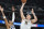 Denver Nuggets center Nikola Jokic, right, goes up for a basket over Dallas Mavericks forward Christian Wood in the second half of an NBA basketball game Wednesday, Feb. 15, 2023, in Denver. (AP Photo/David Zalubowski)
