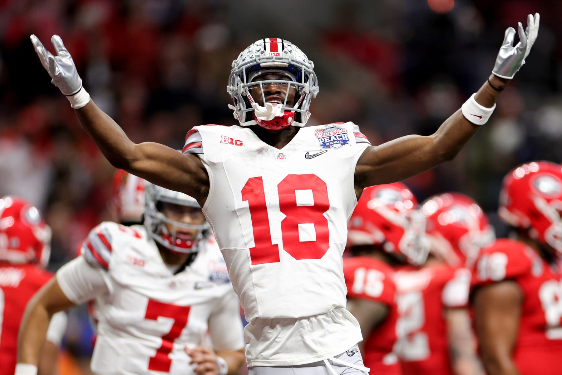 Football Football ATLANTA, GEORGIA - DECEMBER 31: Marvin Harrison Jr. #18 of the Ohio State Buckeyes reacts after a touchdown during the first quarter in the Chick-fil-A Peach Bowl at Mercedes-Benz Stadium on December 31, 2022 in Atlanta, Georgia. (Photo by Carmen Mandato/Getty Images)