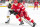 DETROIT, MI - APRIL 05: Brandon Carlo (25) of the Boston Bruins and Tyler Bertuzzi (59) of the Detroit Red Wings fight for the puck during the first period of an NHL game at Little Caesars Arena on April 5, 2022 in Detroit, Michigan. (Photo by Dave Reginek/NHLI via Getty Images)