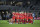 Canada players huddle on the pitch after a SheBelieves Cup women's soccer match against the United States, Thursday, Feb. 16, 2023, in Orlando, Fla. (AP Photo/Phelan M. Ebenhack)