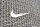 MIAMI BEACH, FLORIDA - DECEMBER 21: The Nike logo hangs above the entrance to the Nike store on December 21, 2021 in Miami Beach, Florida. Nike reported better-than-expected fiscal second-quarter results with revenue of $11.36 billion vs. $11.25 billion expected. (Photo by Joe Raedle/Getty Images)