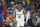 Memphis Grizzlies guard Ja Morant brings the ball up against the Denver Nuggets during the second half of an NBA basketball game Friday, March 3, 2023, in Denver. (AP Photo/David Zalubowski)