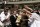 Duke head coach Mike Krzyzewski and the Blue Devils are presented with the championship trophy by Mike Tranghese, chairman of the Division I men's basketball committee, after beating Arizona 82-72 in the final game of the Final Four on Monday, April 2, 2001, in Minneapolis. (AP Photo/Bob Jordan)