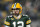 GREEN BAY, WISCONSIN - JANUARY 08: Aaron Rodgers #12 of the Green Bay Packers warms up before a game against the Detroit Lions at Lambeau Field on January 08, 2023 in Green Bay, Wisconsin. (Photo by Patrick McDermott/Getty Images)