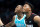CHARLOTTE, NORTH CAROLINA - JANUARY 29: Terry Rozier #3 of the Charlotte Hornets shares a laugh with Kyle Lowry #7 of the Miami Heat while talking during a free throw during the second quarter of a basketball game at Spectrum Center on January 29, 2023 in Charlotte, North Carolina. NOTE TO USER: User expressly acknowledges and agrees that, by downloading and or using this photograph, User is consenting to the terms and conditions of the Getty Images License Agreement. (Photo by David Jensen/Getty Images)