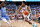 GREENSBORO, NORTH CAROLINA - MARCH 09: Reece Beekman #2 of the Virginia Cavaliers drives against D'Marco Dunn #11 of the North Carolina Tar Heels during the first half in the quarterfinals of the ACC Basketball Tournament at Greensboro Coliseum on March 09, 2023 in Greensboro, North Carolina. (Photo by Grant Halverson/Getty Images)