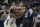 Milwaukee Bucks center Brook Lopez, left scuffles with Sacramento Kings forward Trey Lyles as members of both teams intervene in the final seconds of the second half of an NBA basketball game in Sacramento, Calif., Monday, March 13, 2023. Lopez and Lyles were both ejected from the game. The Bucks won 133-124. (AP Photo/Randall Benton)