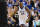 GREENSBORO, NORTH CAROLINA - MARCH 17: Oscar Tshiebwe #34 of the Kentucky Wildcats reacts after a play during the first half against the Providence Friars in the first round of the NCAA Men's Basketball Tournament at The Fieldhouse at Greensboro Coliseum on March 17, 2023 in Greensboro, North Carolina. (Photo by Jacob Kupferman/Getty Images)