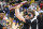 Iowa guard Caitlin Clark shows off the trophy as she celebrates after an Elite 8 college basketball game of the NCAA Tournament against Louisville, Sunday, March 26, 2023, in Seattle. Iowa won 97-83. (AP Photo/Caean Couto)