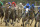 Creator, with jockey Ricardo Santana Jr., center rear, runs in 11th place entering the stretch of the Arkansas Derby horse race at Oaklawn Park in Hot Springs, Ark., Saturday, April 16, 2016. Creator won the race. (AP Photo/Devid Quinn)