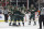 Minnesota Wild defenseman John Klingberg (3) celebrates with teammates after scoring against the Vegas Golden Knights during the second period of an NHL hockey game Monday, April 3, 2023, in St. Paul, Minn. (AP Photo/Stacy Bengs)
