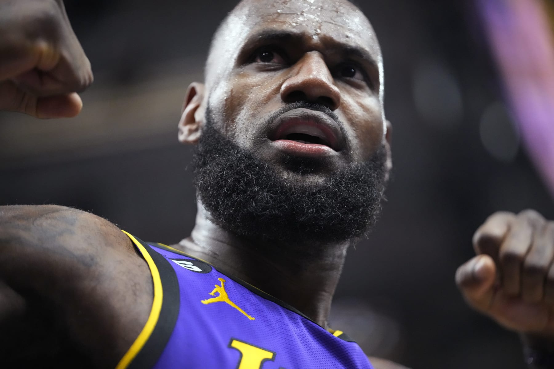Los Angeles Lakers forward LeBron James reacts after scoring against the Utah Jazz during the first half of an NBA basketball game Tuesday, April 4, 2023, in Salt Lake City. (AP Photo/Rick Bowmer)